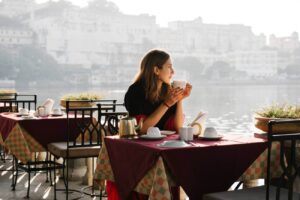 woman-traveller-having-teatime-cafe-udaipur