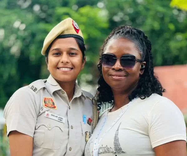 Tourist Poses with Delhi Police Officer During Golden Triangle Group Tour